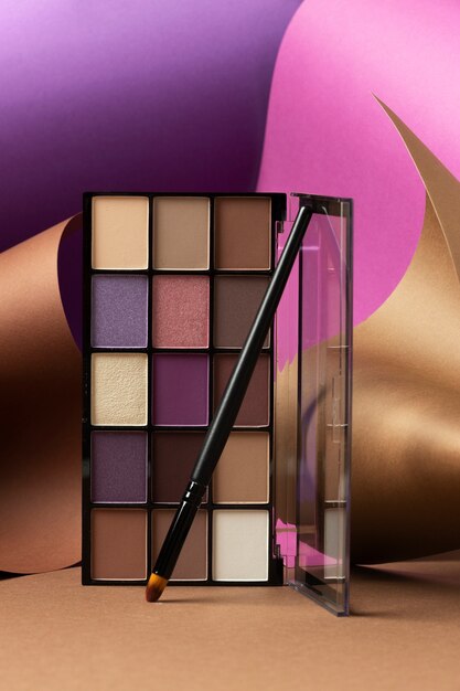 Free Photo view of eyeshadow palette with brush applicator