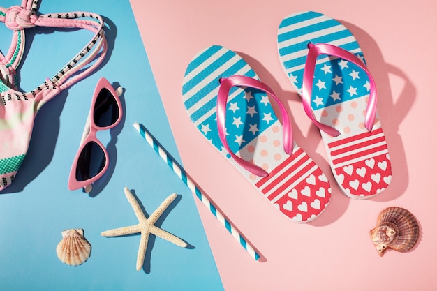 View of flip flops with summer essentials