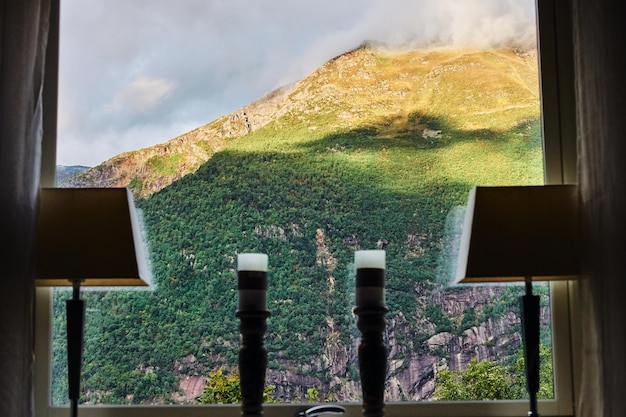 Free Photo view from the window of a house on a beautiful mountain top in norway at a sunset.