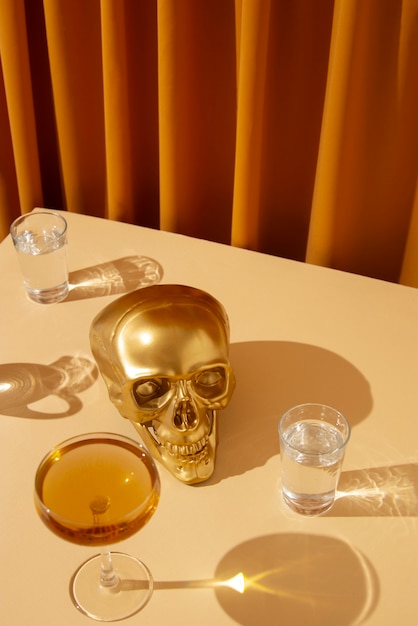 View of golden skull with alcoholic drink