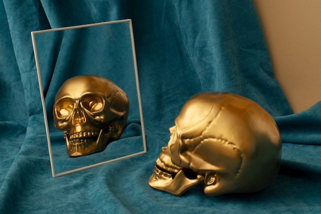 View of golden skull with mirror