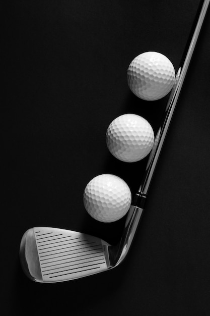 View of golf balls with metallic club