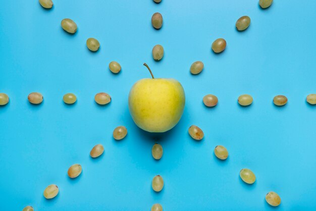 Above view grapes and apple arrangement