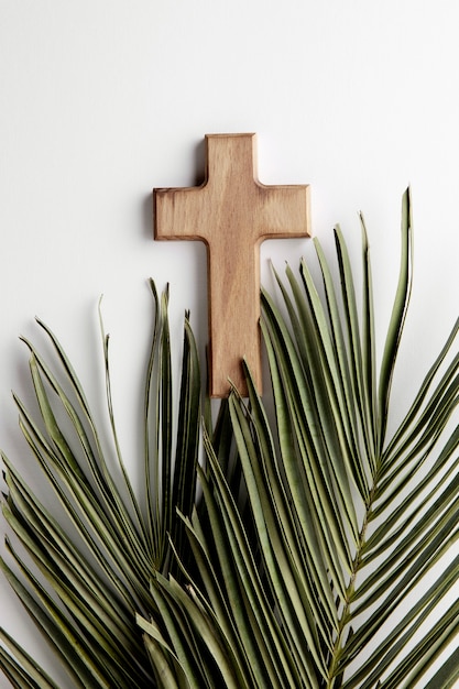 Above view green leaves and cross arrangement