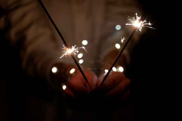 Free Photo view of hands holding sparkles