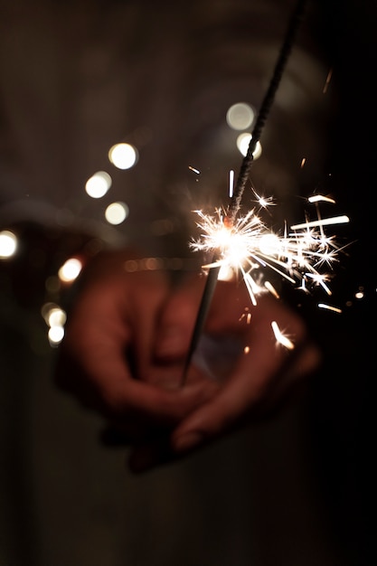 View of hands holding sparkles