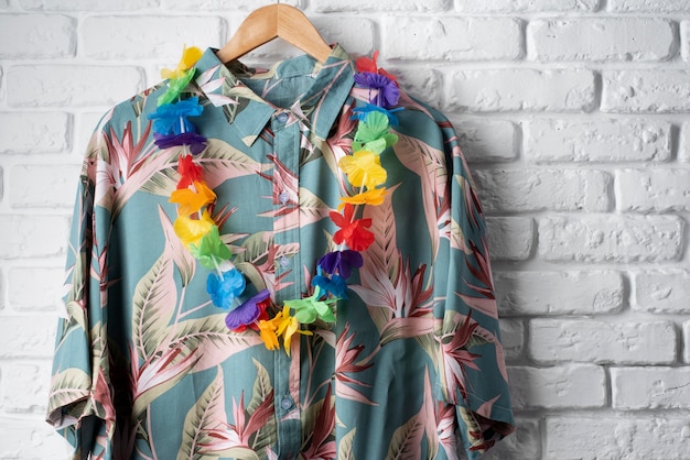 View of hawaiian shirt on hanger with garland