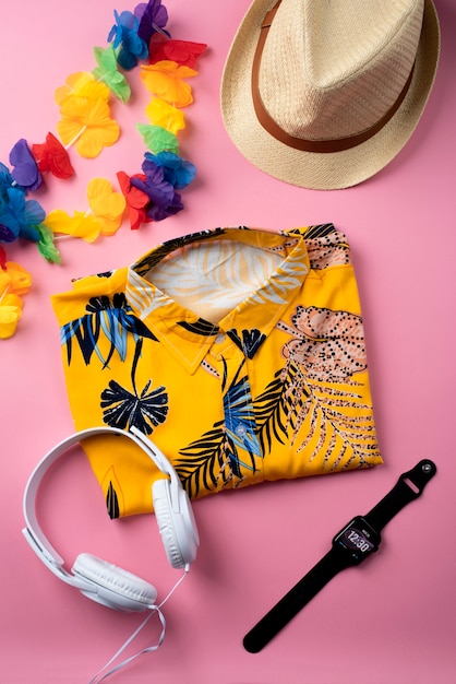 Free Photo view of hawaiian shirt with headphones and smartwatch