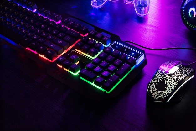 Free Photo view of illuminated neon gaming keyboard setup and controller