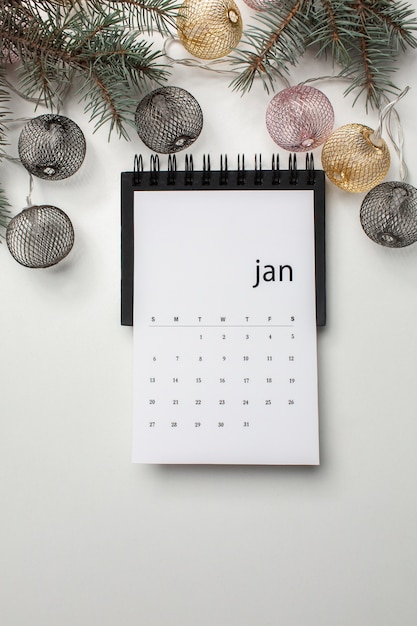 Free photo above view january calendar and twigs