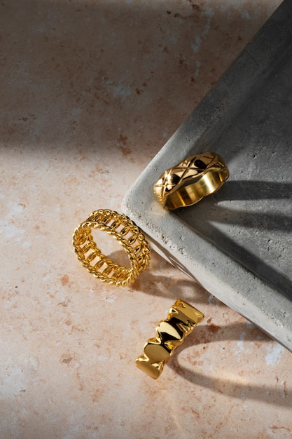 Free Photo view of luxurious golden ring on rock or concrete tray