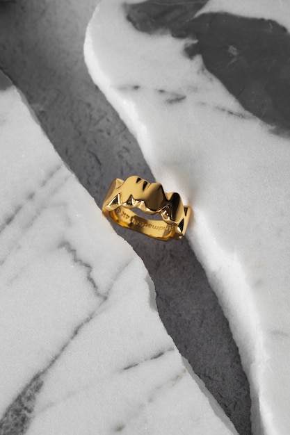 Free photo view of luxurious golden ring with marble