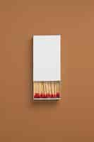 Free photo view of matchbox with wooden matchstiks