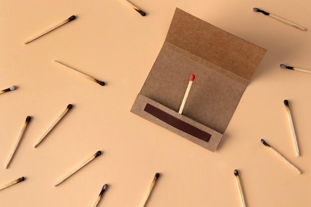 Free Photo view of matchbox with wooden matchstiks