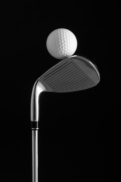 Free Photo view of metallic golf club with ball