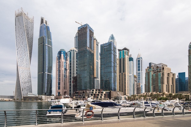 Free photo view of modern skyscrapers shining in sunrise lights in dubai marina in dubai, uae.