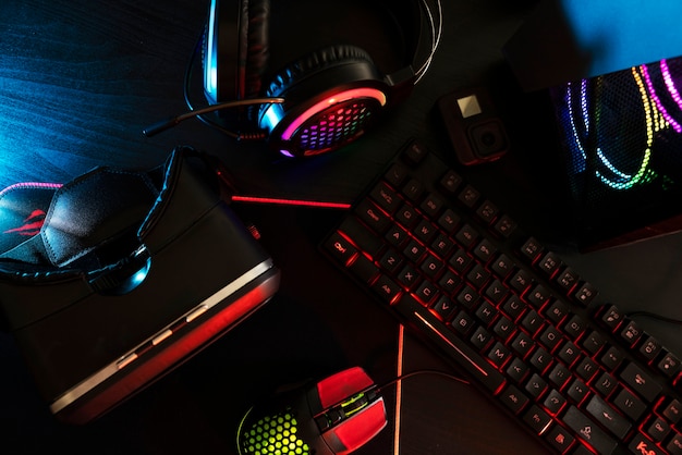 Free Photo view of neon illuminated gaming desk setup with keyboard