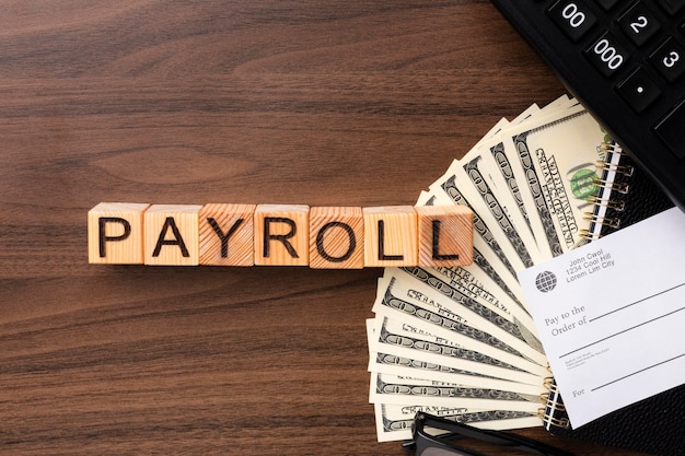 Above view payroll concept with cash