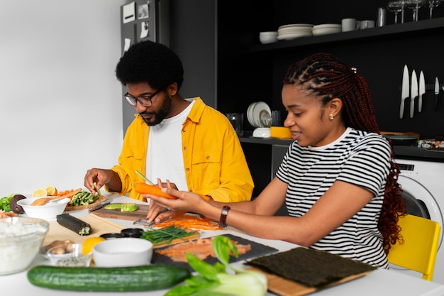 View of people learning how to make traditional sushi dish