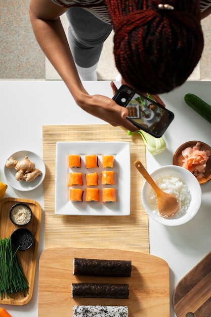 Free Photo view of people learning how to make traditional sushi dish