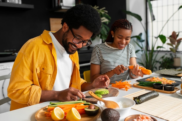 View of people learning how to make traditional sushi dish