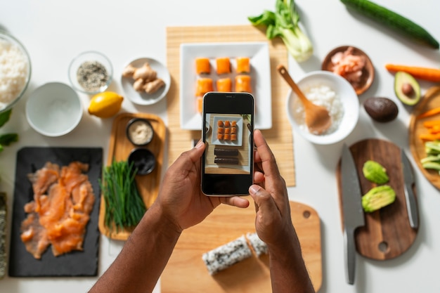 Free Photo view of people learning how to make traditional sushi dish