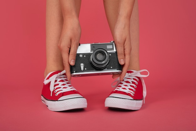 Free photo view of person holding professional digital camera