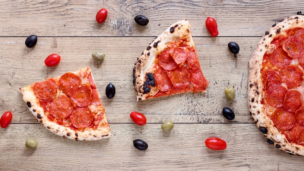 Above view pizza on wooden background