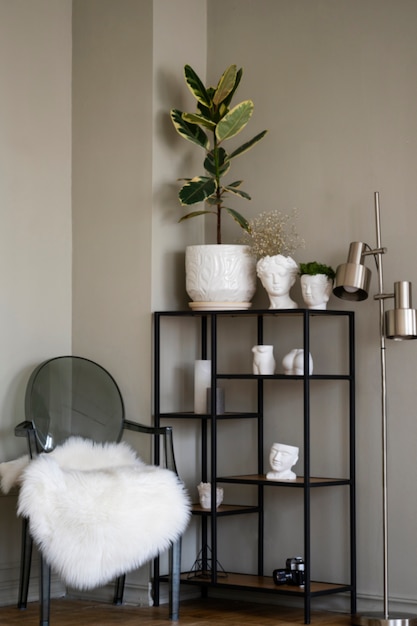 View of potted plant in room on metal shelf