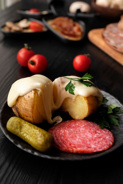 Free Photo view of raclette dish with delicious food assortment