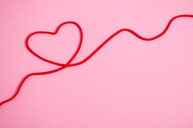 Free photo view of red thread with heart shape