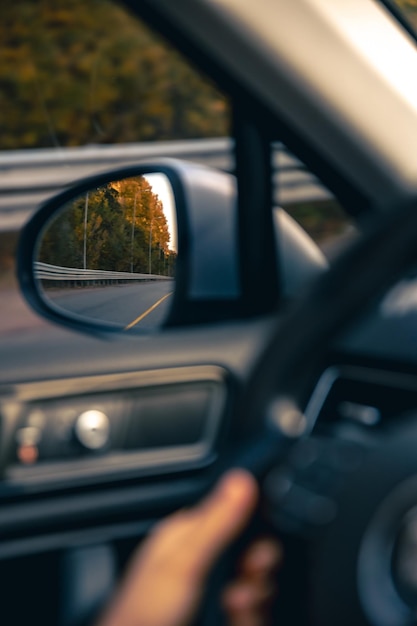 Free Photo the view of the road in the cars rearview mirror