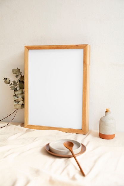 View of room decor made up of frame and plates with wood spoon