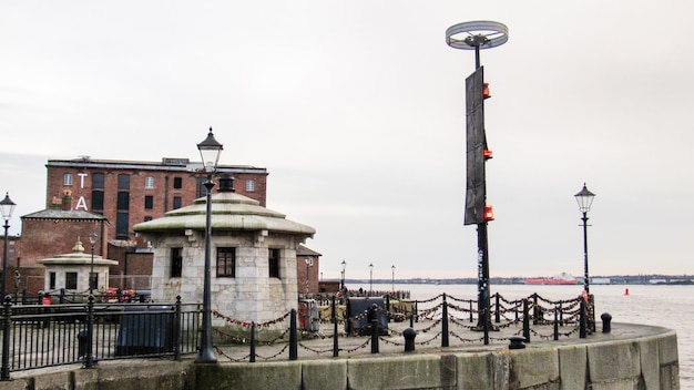 Free Photo view of the royal albert dock in liverpool united kingdom old buildings mersey river embankment