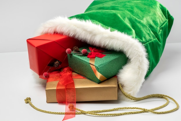 Free Photo view of santa claus bag with gift boxes