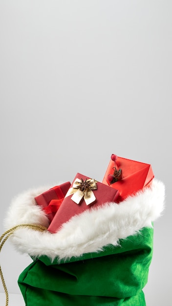 Free Photo view of santa claus bag with wrapped gifts