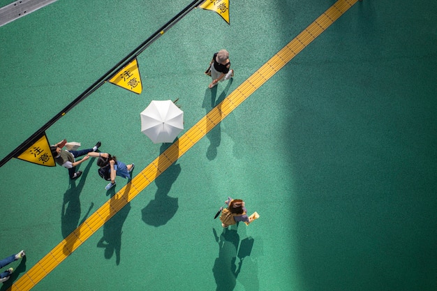 Free Photo view of street with daylight shadows and people