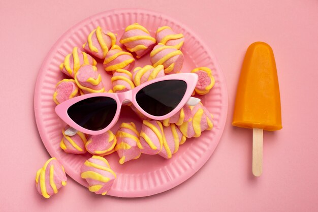 View of summer sunglasses with marshmallows and ice cream