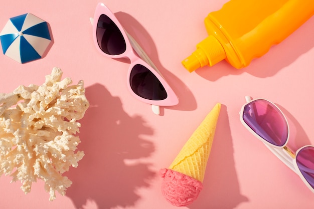 View of sunglasses with summer essentials and watermelon bag