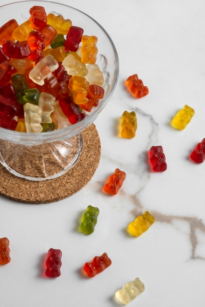 View of sweet gummy bears with bowl