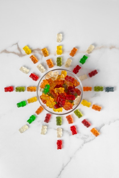 Free Photo view of sweet gummy bears with bowl