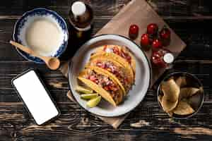 Free photo above view tacos with vegetables and meat