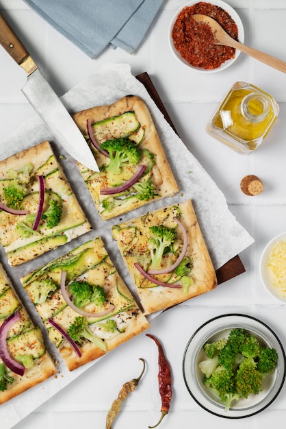 Above view tasty pizza on wooden board