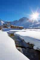 Free photo view of tignes village with sun and creek, france.