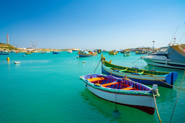 Free photo view of traditional fishing boats luzzu in the marsaxlokk harbor in malta