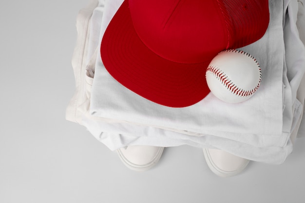 Free photo view of trucker hat with baseball equipment