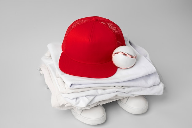 Free Photo view of trucker hat with baseball equipment