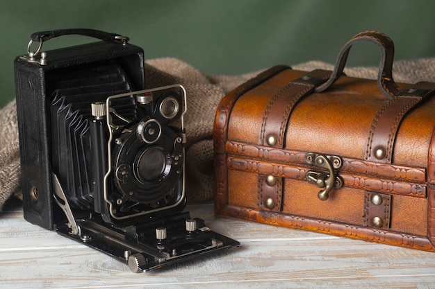 Free Photo view of vintage treasure chest with camera