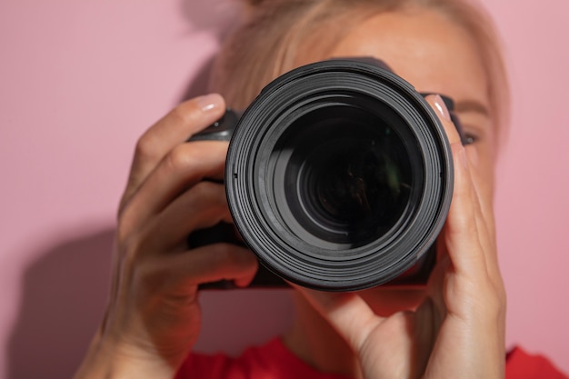 View of woman using professional camera