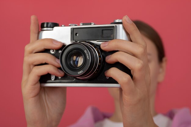 View of woman using professional camera